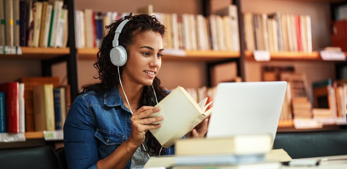 Student in the Library on her laptop